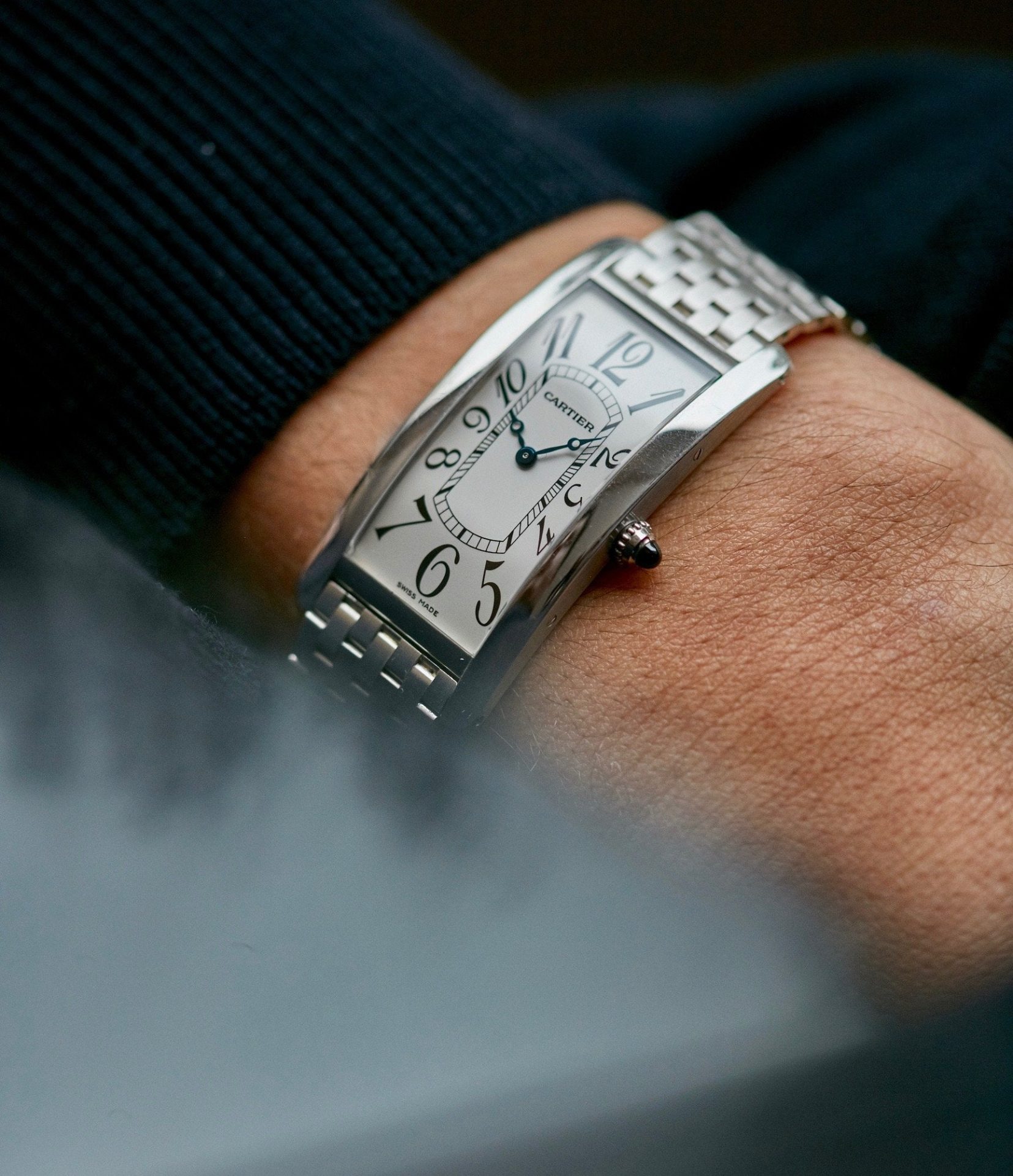 Cartier Tank Cintrée Platinum watch on wrist In A Collector’s Guide to the “Collection Privée Cartier Paris” for A Collected Man London