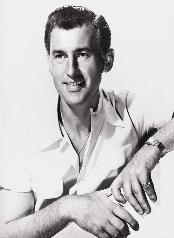 Stewart Granger  wearing Cartier Tank Cintrée watch In A Collector’s Guide to the “Collection Privée Cartier Paris” for A Collected Man London