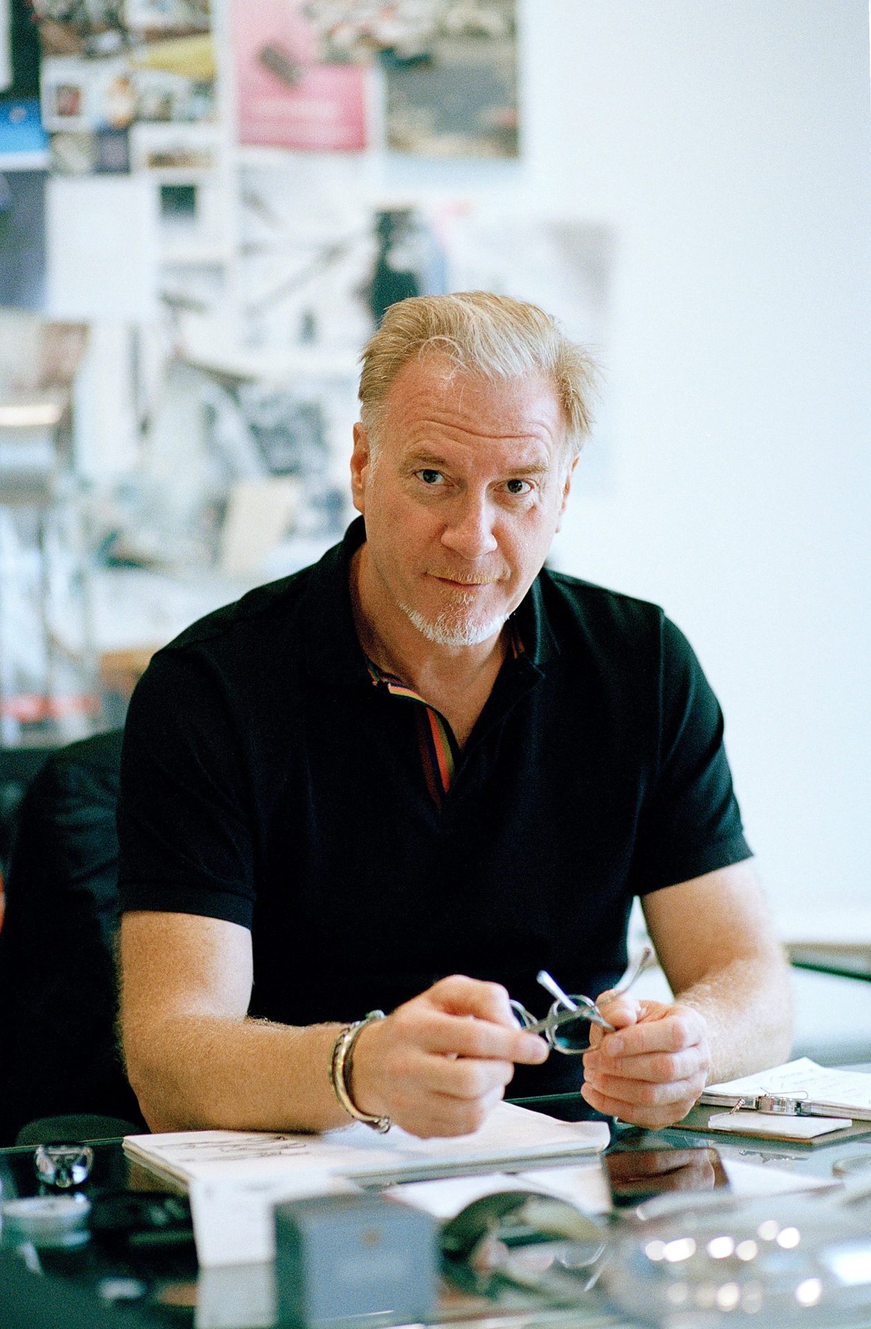 Marek sat at desk in Obsessions: Design with Marek Reichman for A Collected Man London