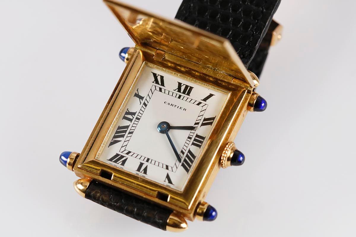 Cartier Tank Obus Savonnette open yellow gold with five blue sapphire cabochons for A Collected Man Lodnon