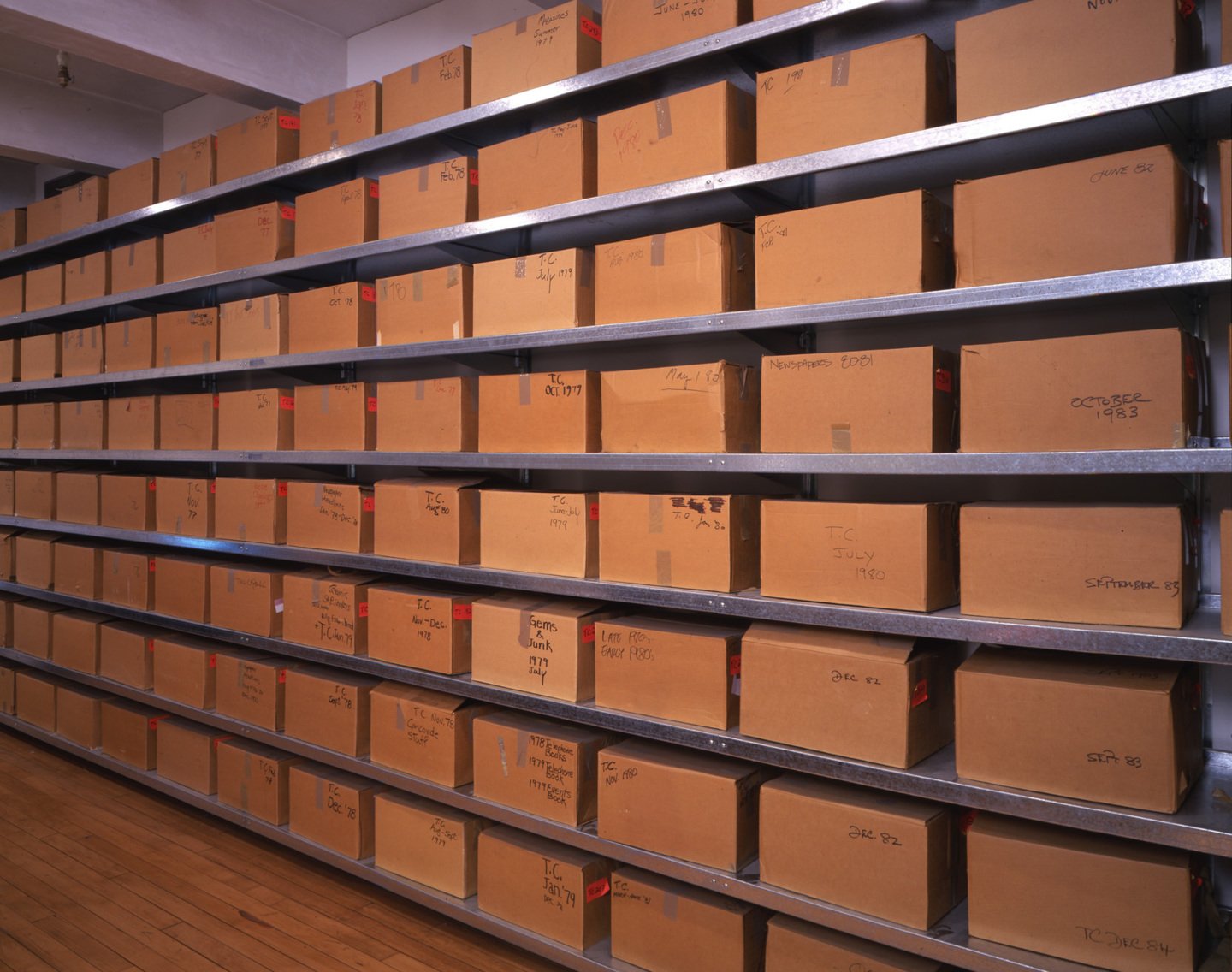 Wall of boxes containing Andy Warhol time capsules in Understanding Andy Warhol as a collector for A Collected Man