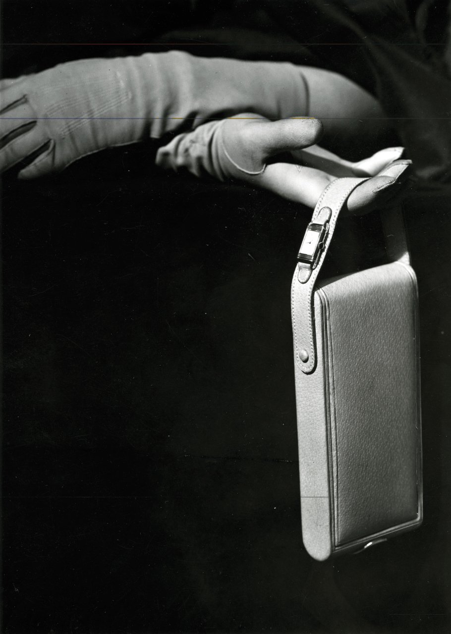 Advert with Jaeger-LeCoultre Reverso on handbag strap in The Flippin’ History of the Reverso for A Collected Man